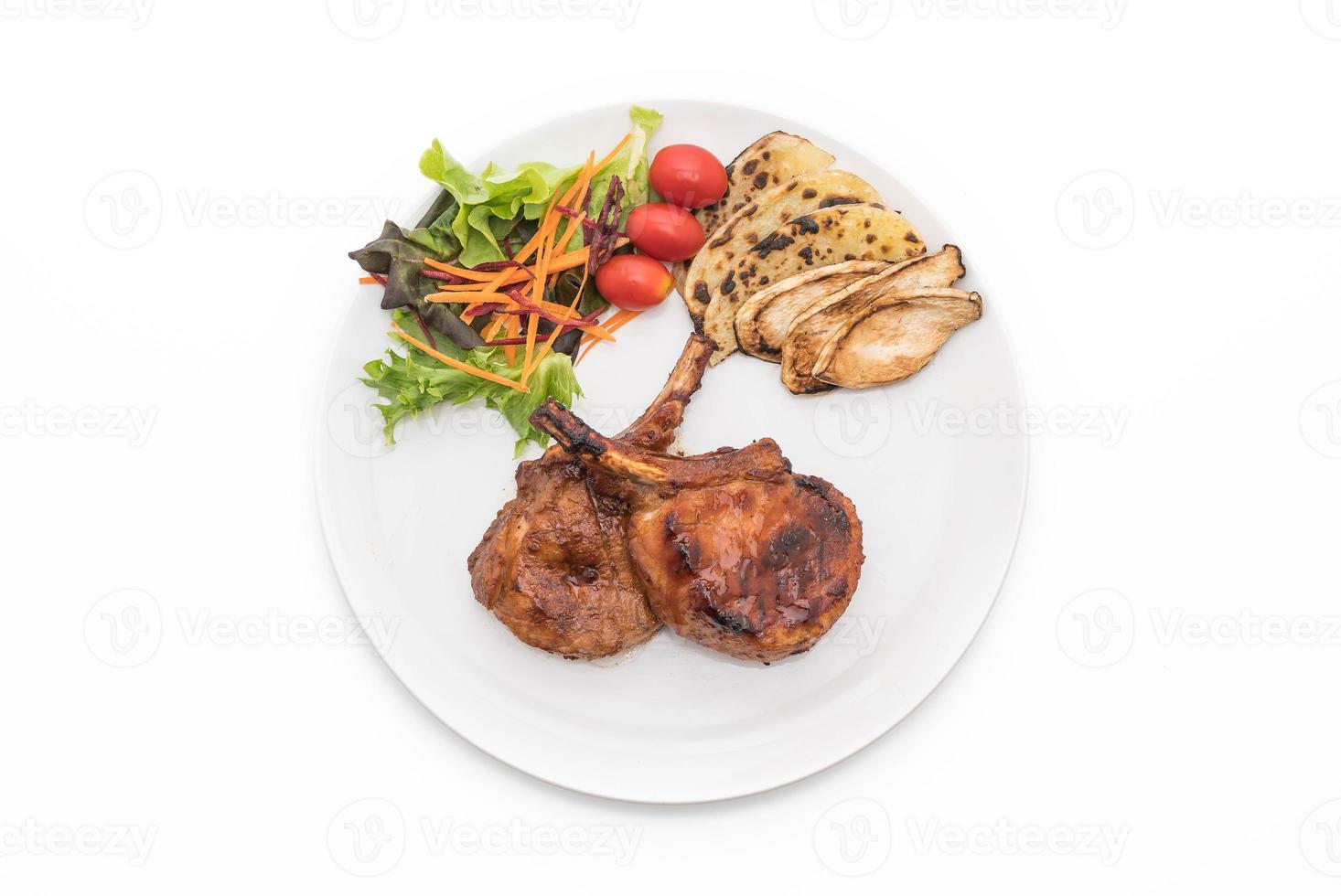 Pork chop steak on white background photo