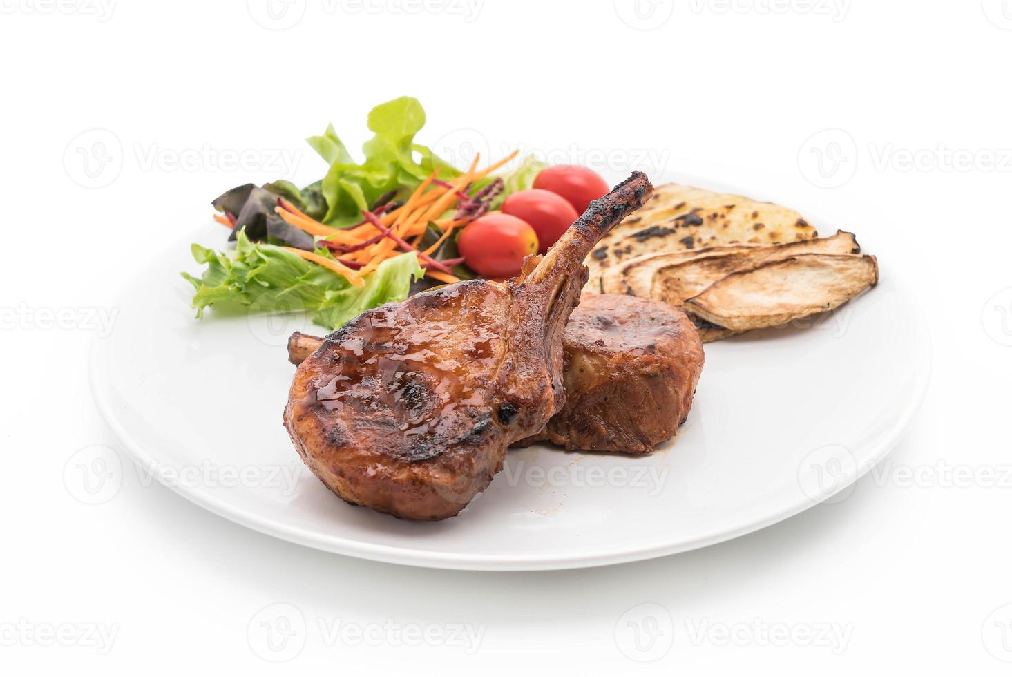 Pork chop steak on white background photo