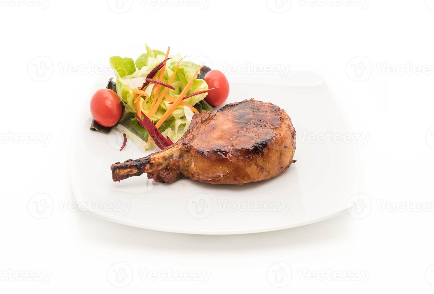 Pork chop steak on white background photo