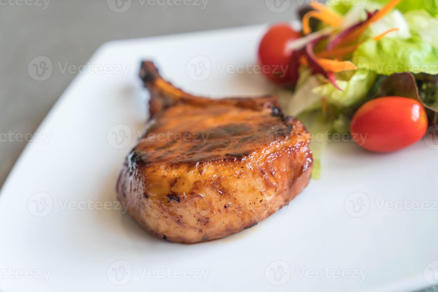 Pork chop steak on the table photo