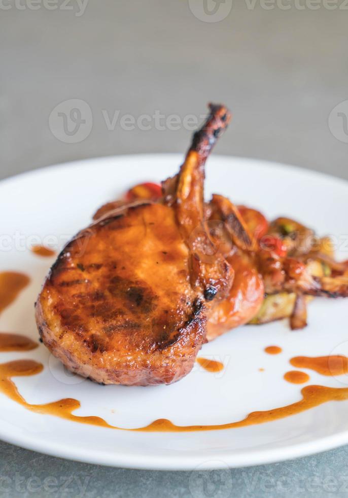 Pork chop steak on the table photo