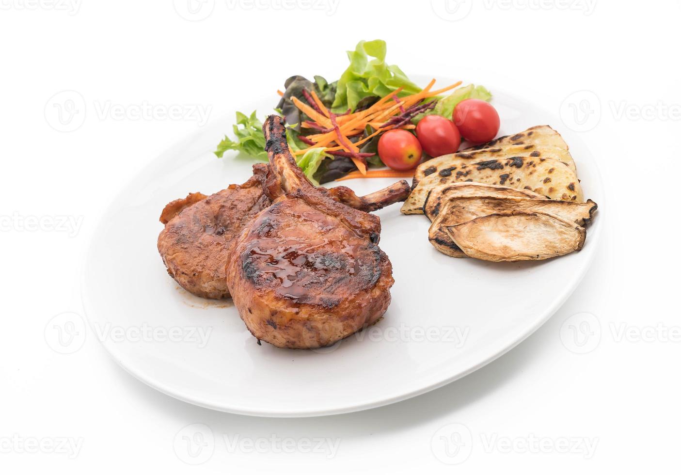 Pork chop steak on white background photo