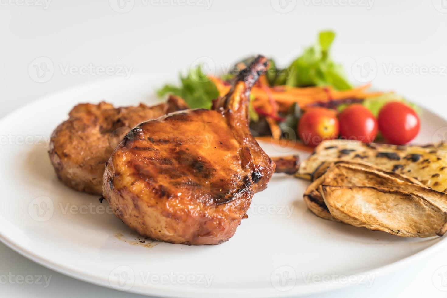 Pork chop steak on the table photo