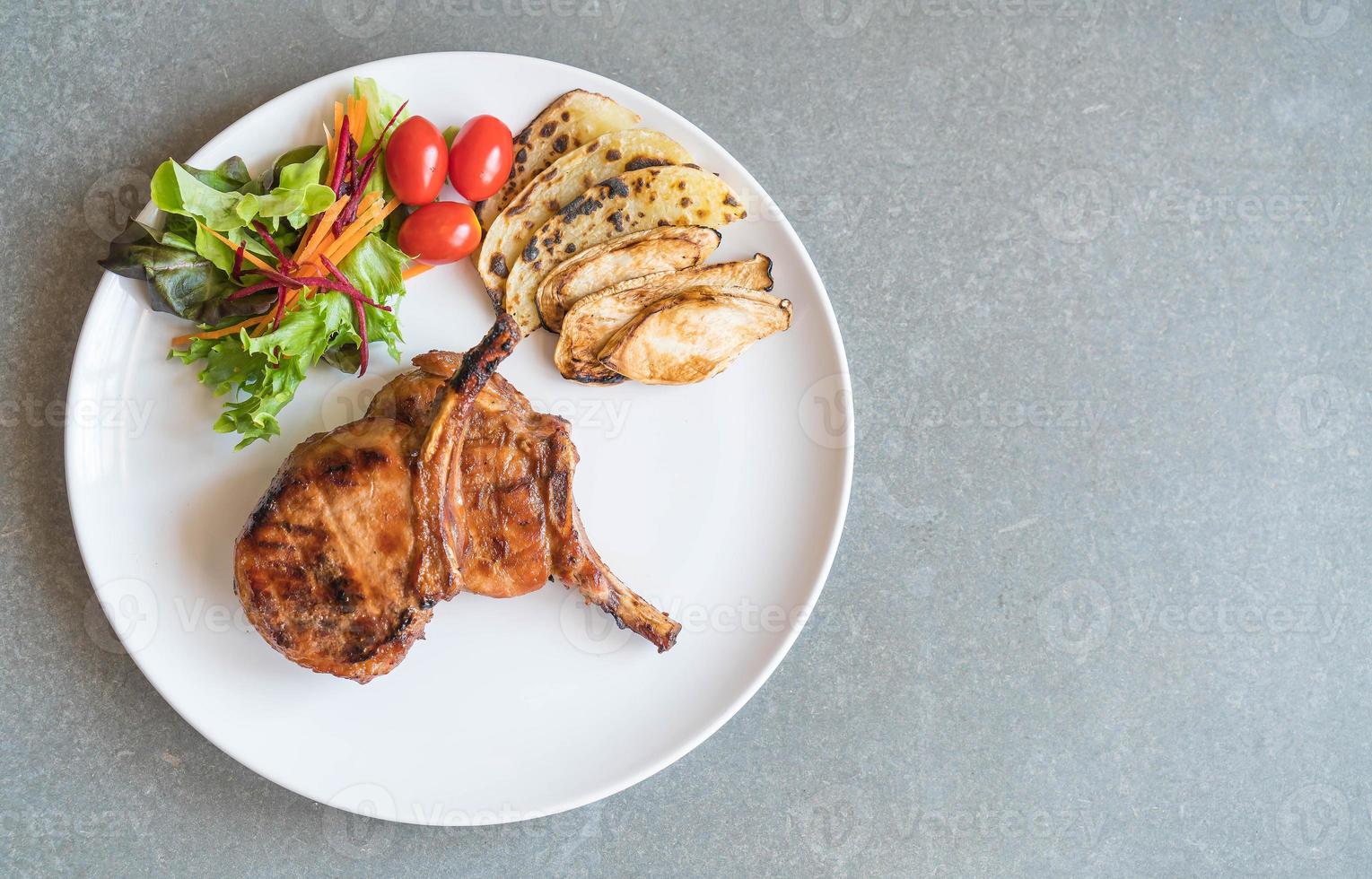 Pork chop steak on the table photo