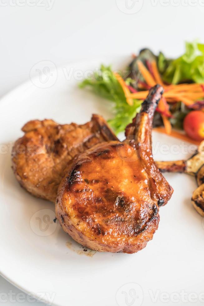 Pork chop steak on the table photo