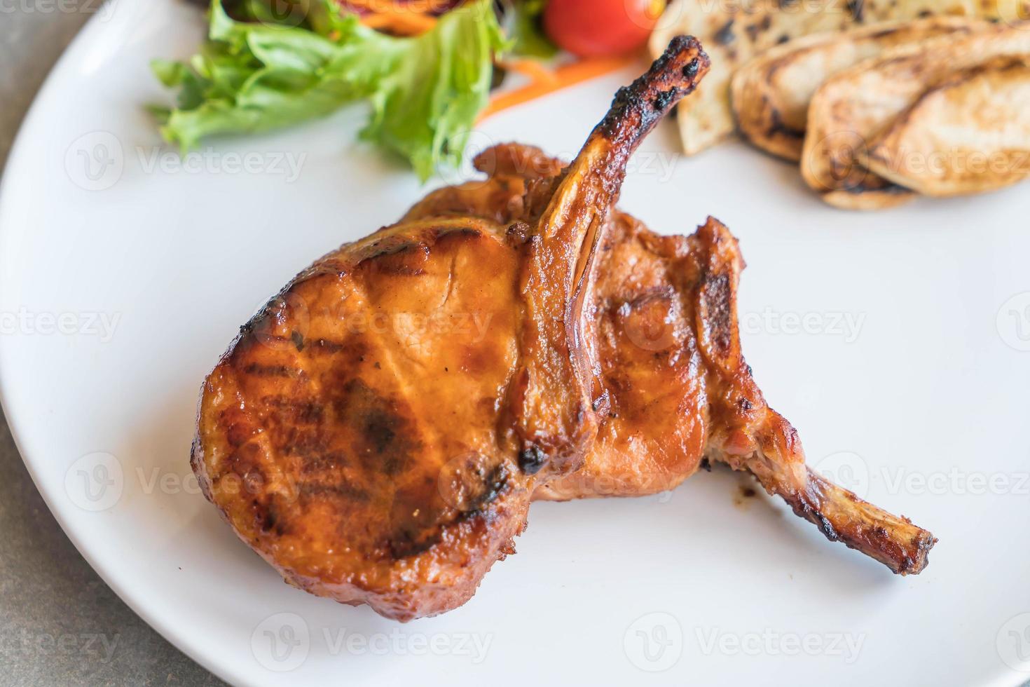 Pork chop steak on the table photo