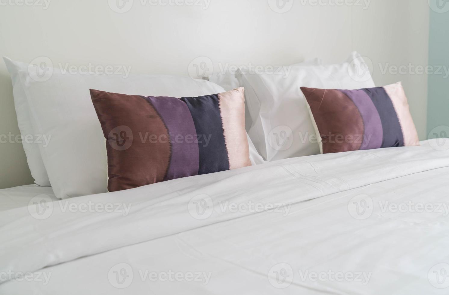 Pillow on bed decoration in bedroom interior photo