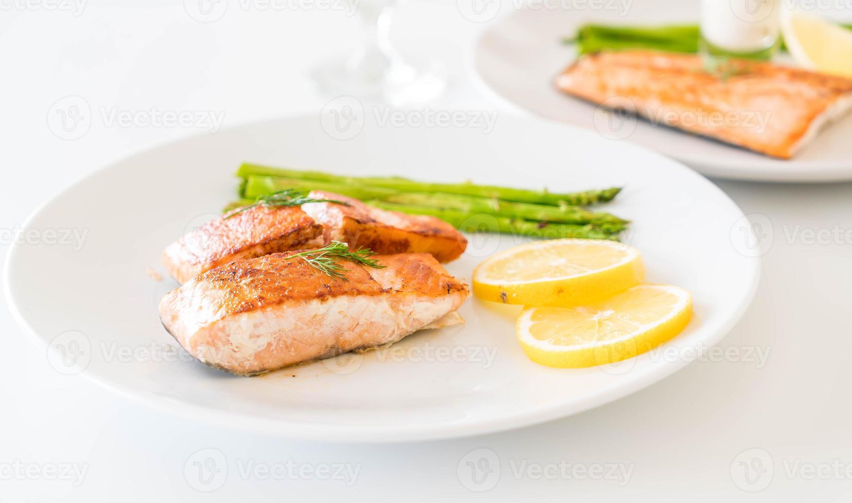 Grilled salmon steak on the table photo