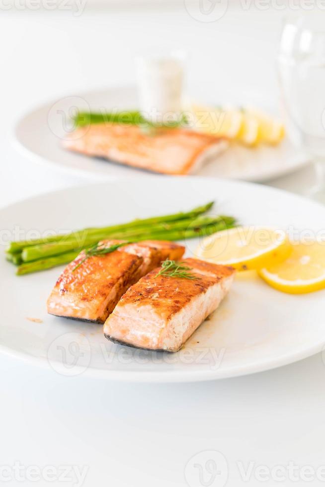 Grilled salmon steak on the table photo