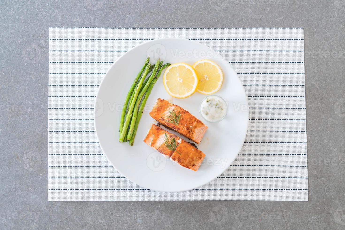 Grilled salmon steak on the table photo