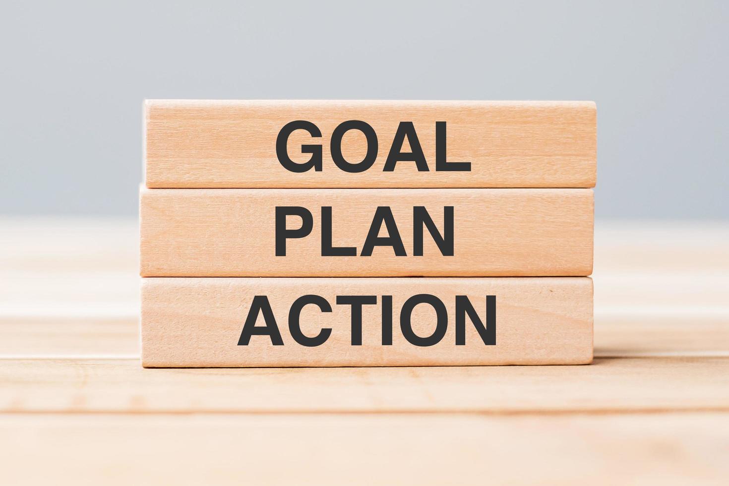 Wooden block with GOAL, PLAN and ACTION photo