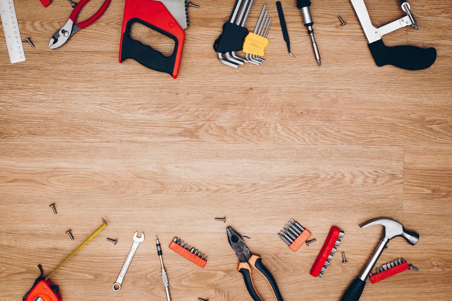 Working tools on wooden background. top view photo