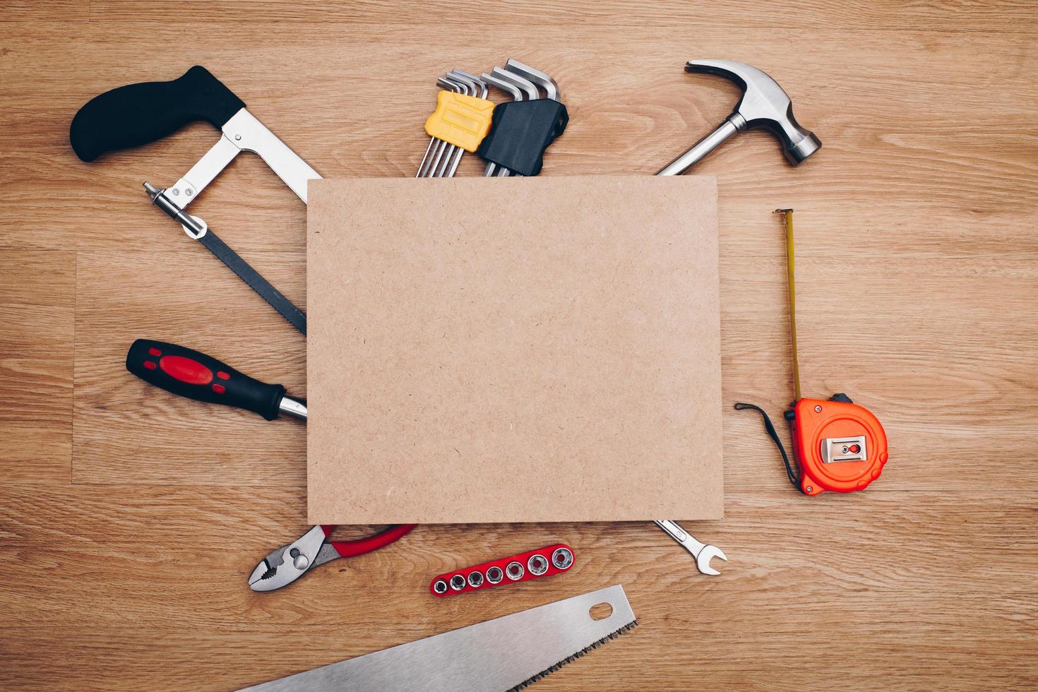 Working tools on wooden background. top view photo