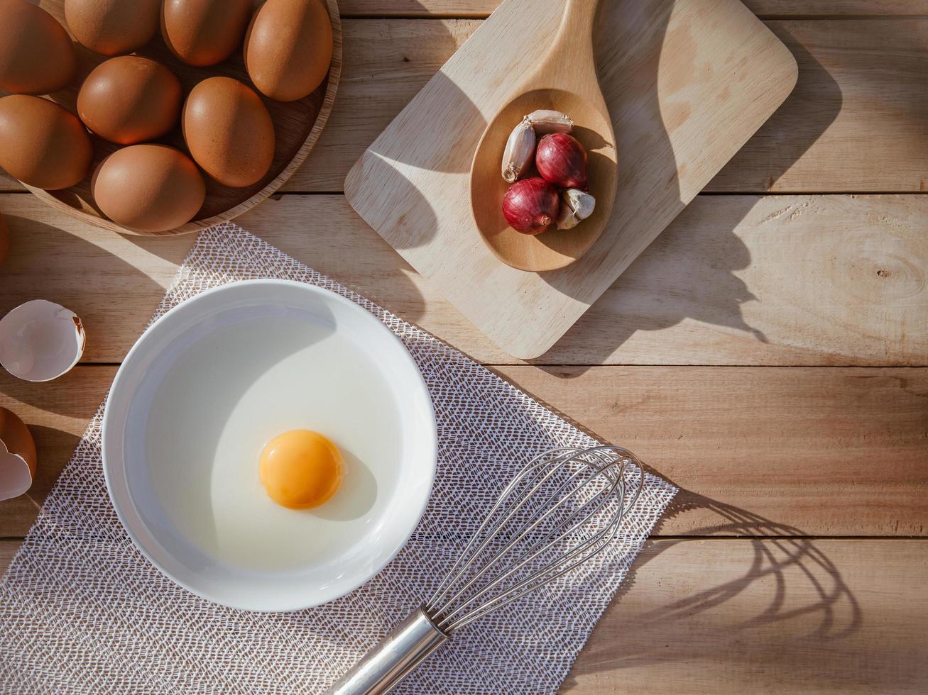 Eggs lay on wooden trays and have broken eggs. photo