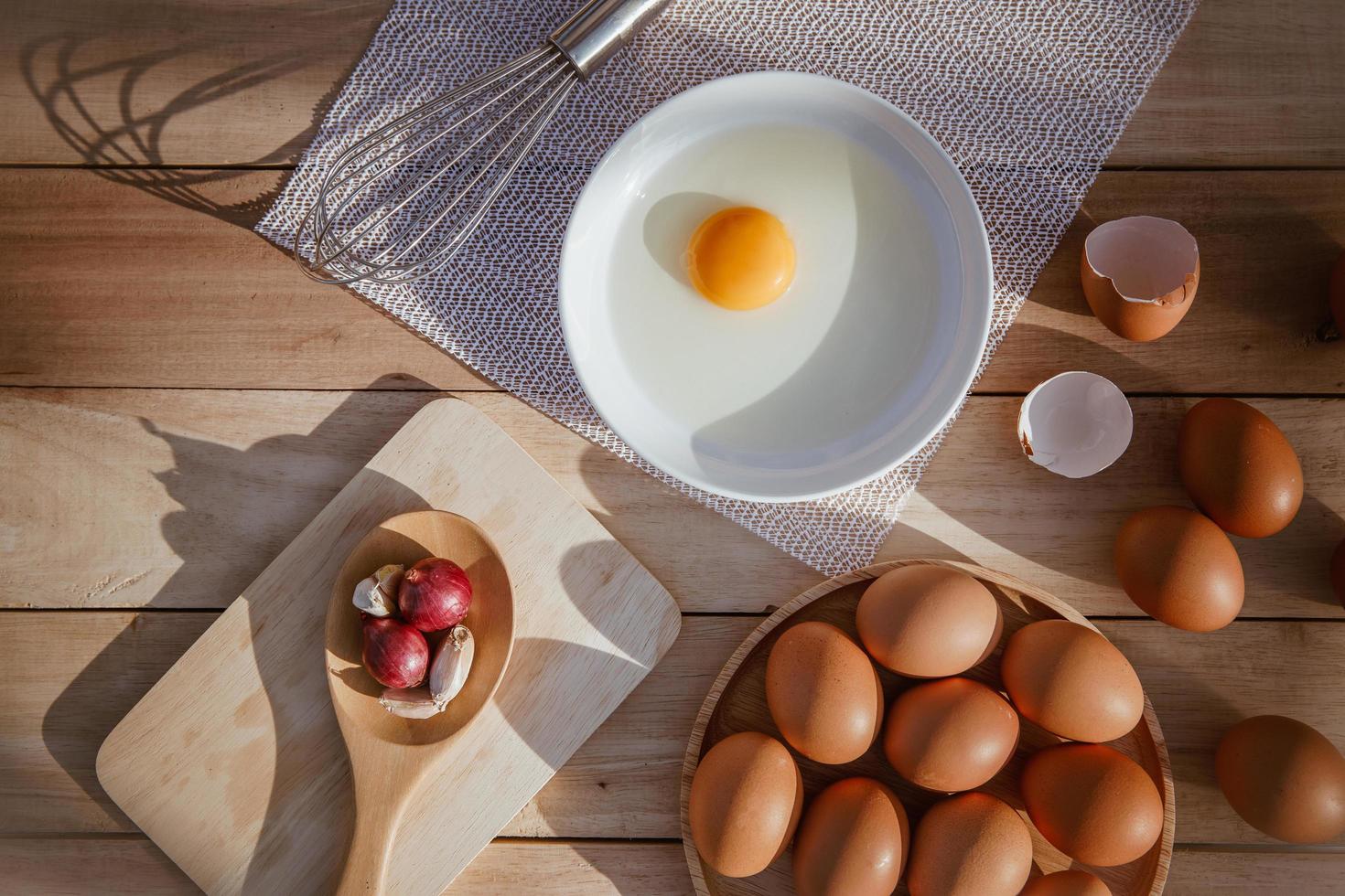 Eggs lay on wooden trays and have broken eggs. photo