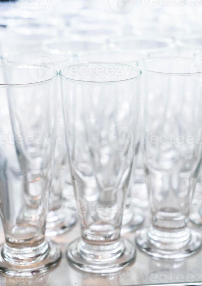 Many empty glasses in a line photo