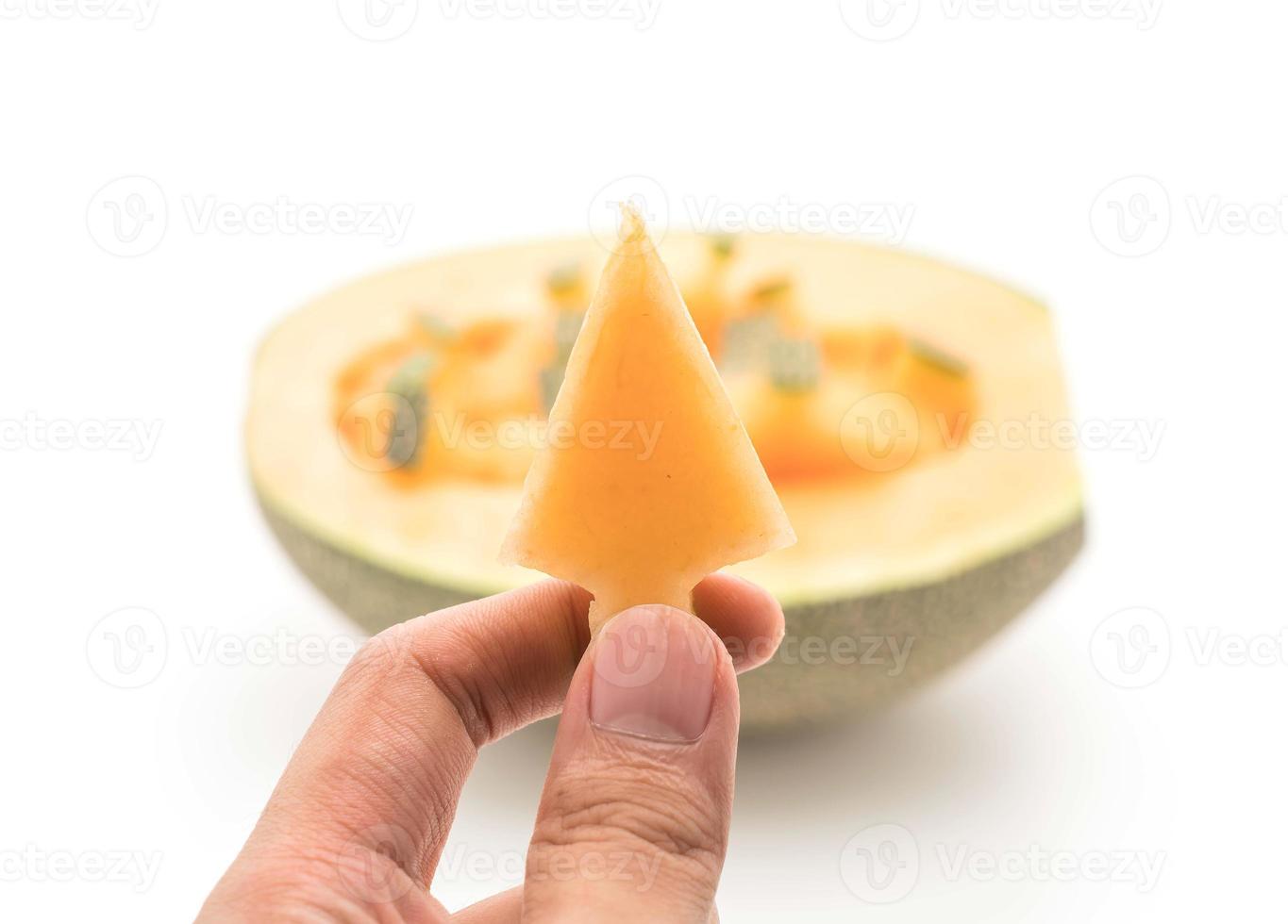 Melón cantalupo sobre fondo blanco. foto