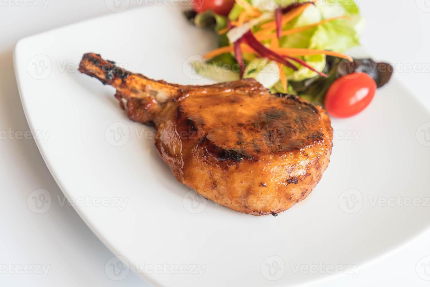 Pork chop steak on the table photo