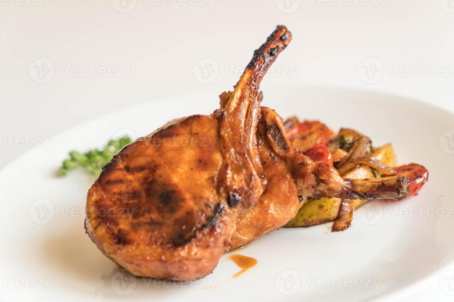 Pork chop steak on the table photo