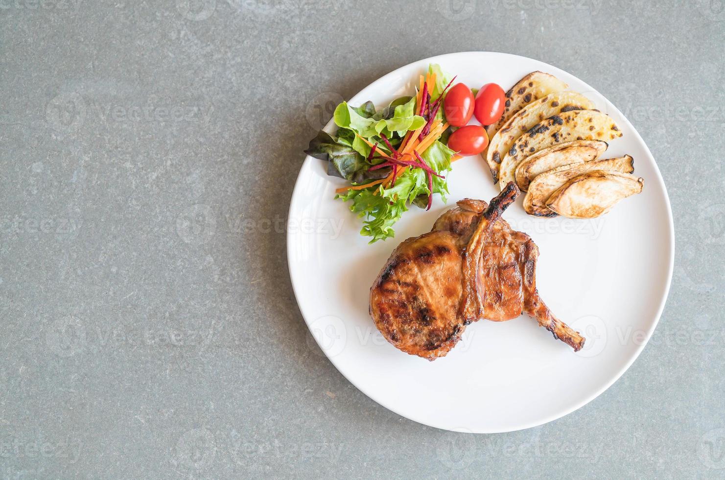 Pork chop steak on the table photo