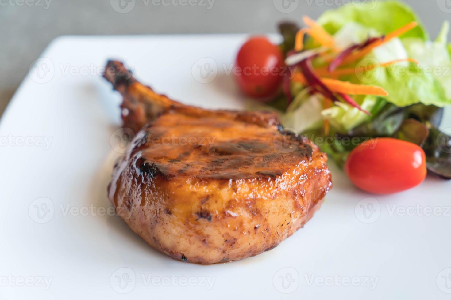 Pork chop steak on the table photo