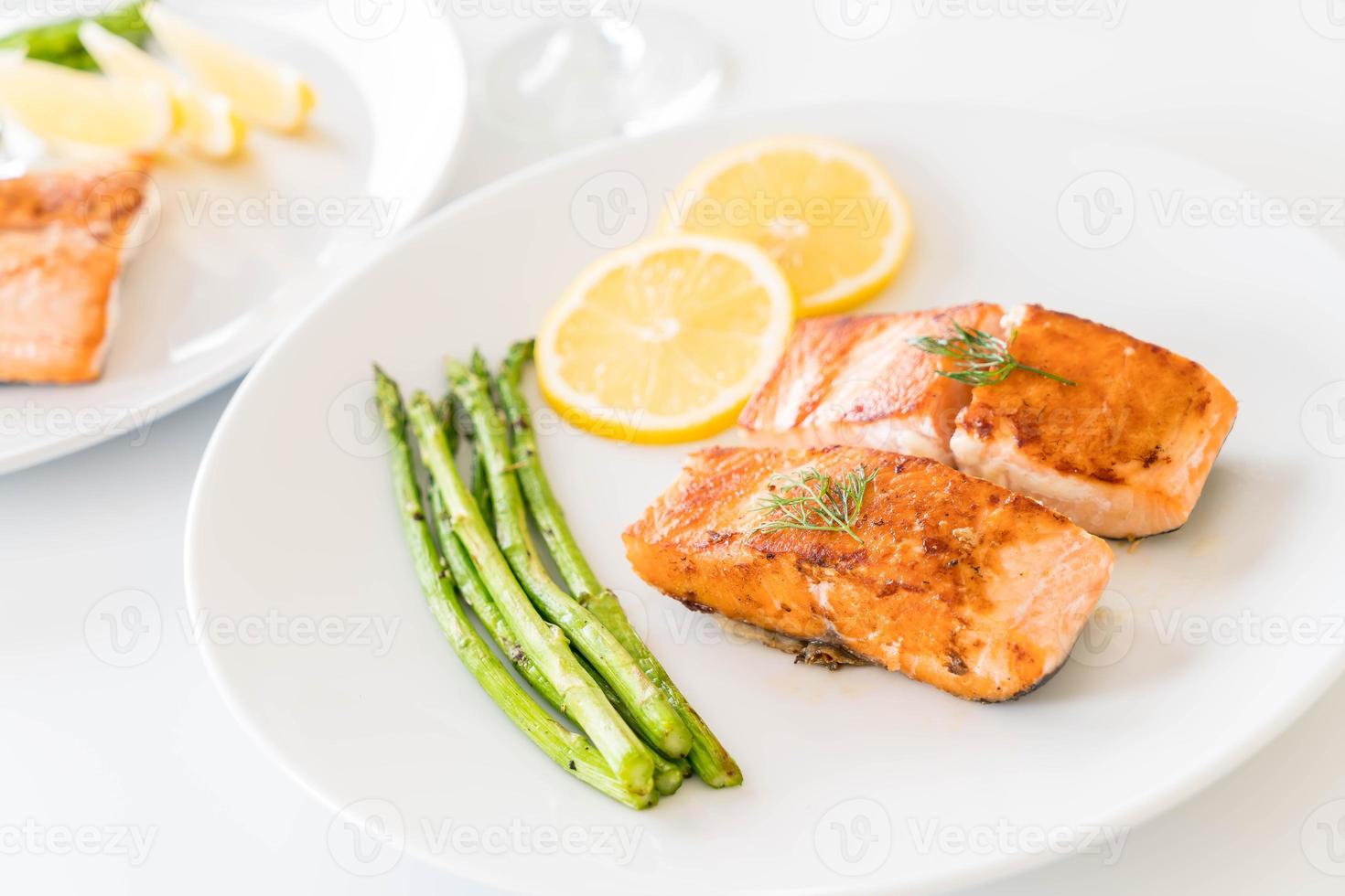 Grilled salmon steak on the table photo