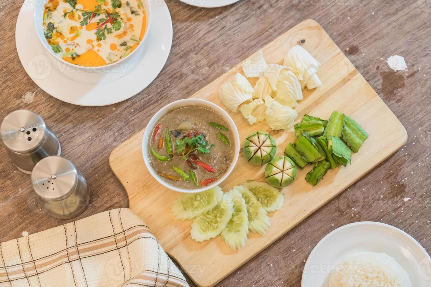 Mixed Thai traditional food on wood table photo