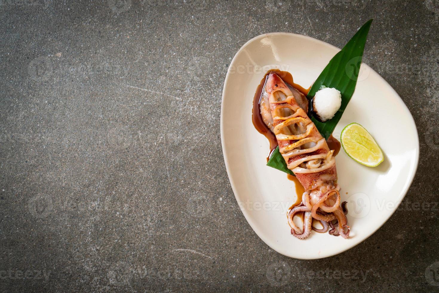 Grilled squid with teriyaki sauce on plate photo