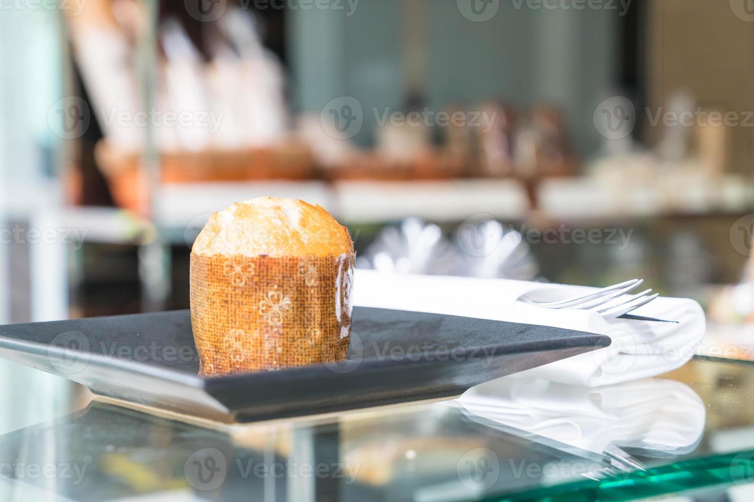 Muffin cake on plate in cafe photo