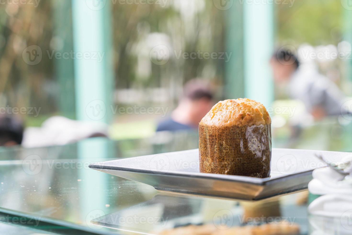 Muffin cake on plate in cafe photo