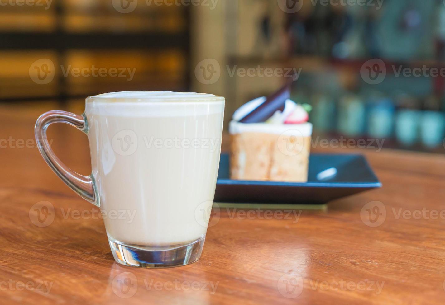 Hot latte coffee cup in coffee shop photo