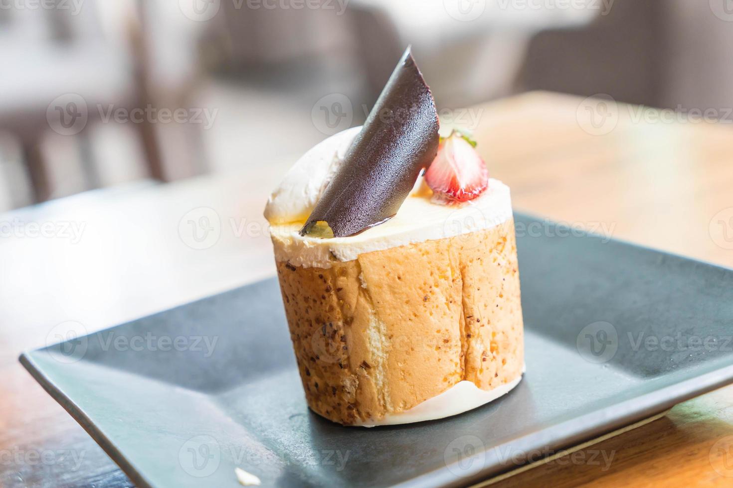 Mango and passion fruits mousse cake in cafe photo