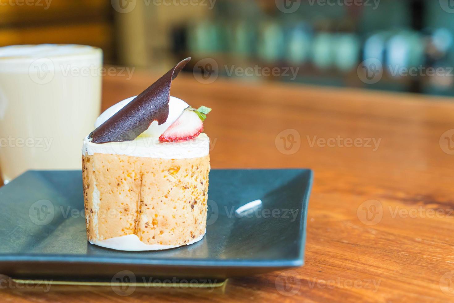 Mango and passion fruits mousse cake in cafe photo