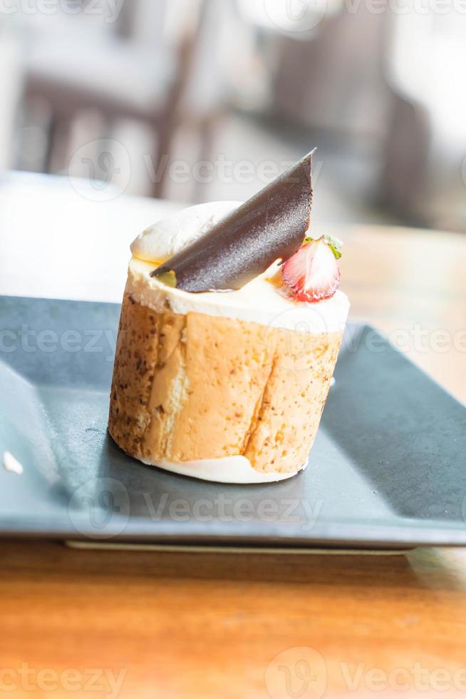 Mango and passion fruits mousse cake in cafe photo