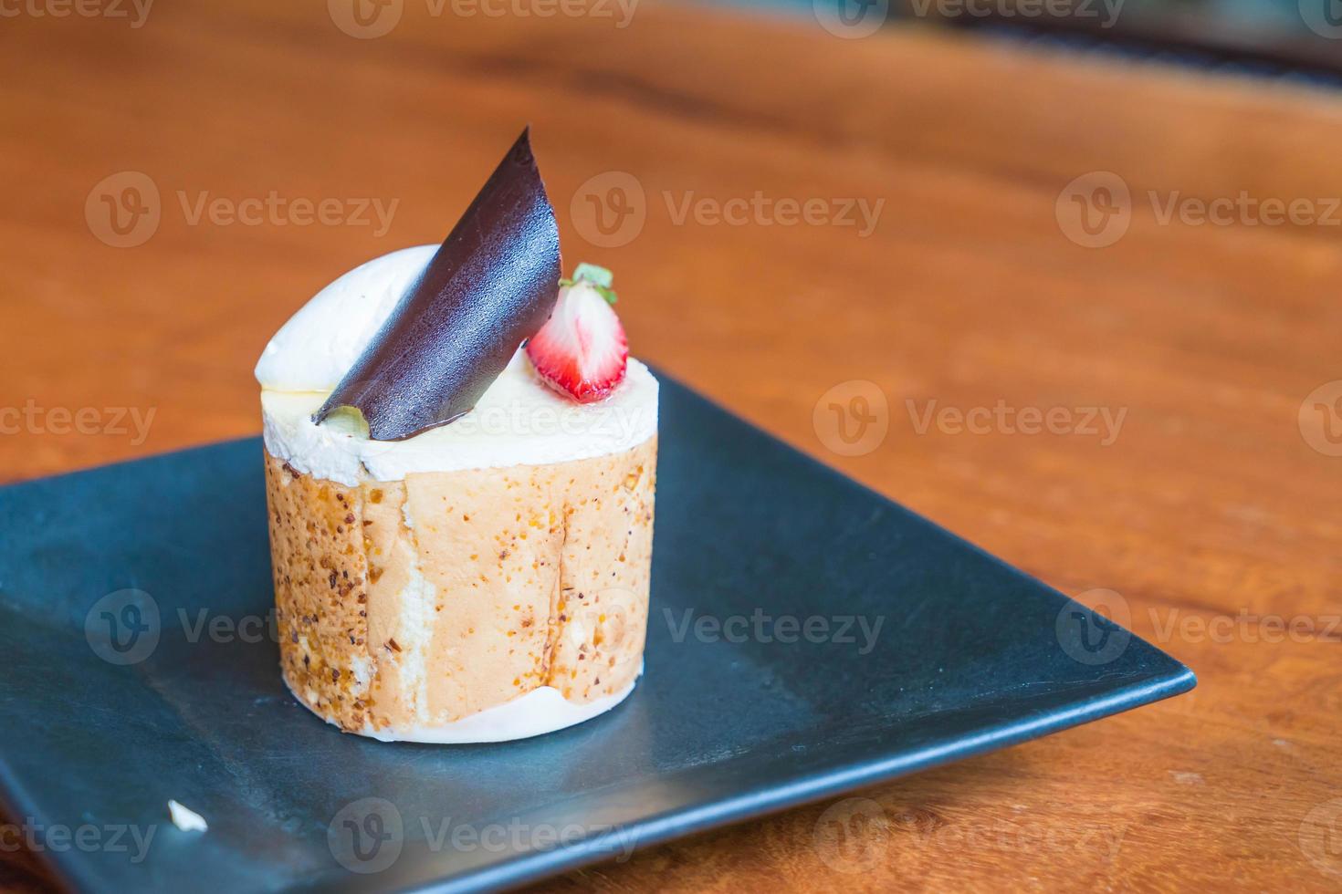 Mango and passion fruits mousse cake in cafe photo