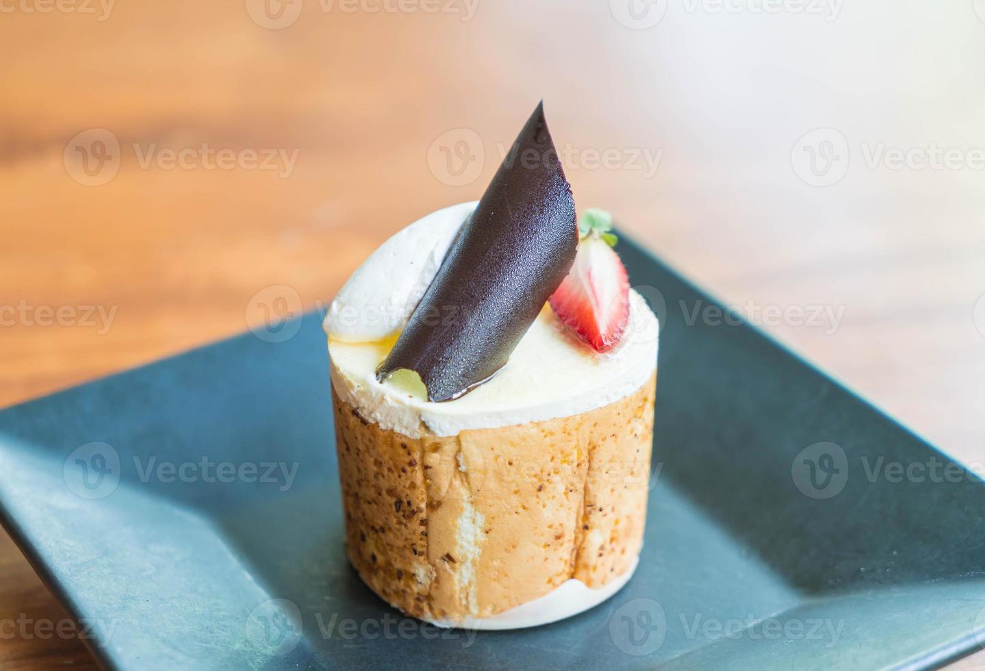 Mango and passion fruits mousse cake in cafe photo