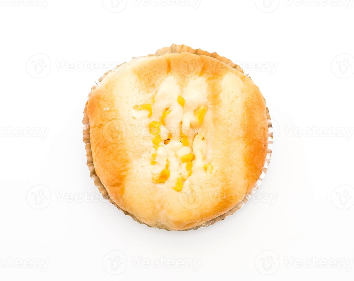 Bread with corn and mayonnaise on white background photo