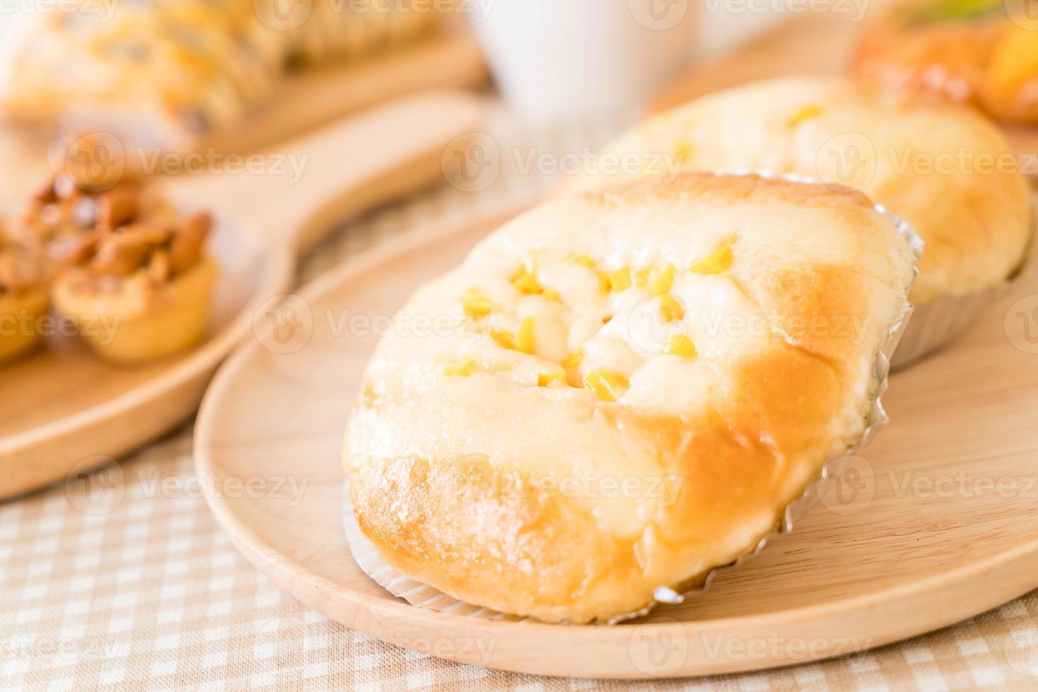 Bread with corn and mayonnaise on the table photo