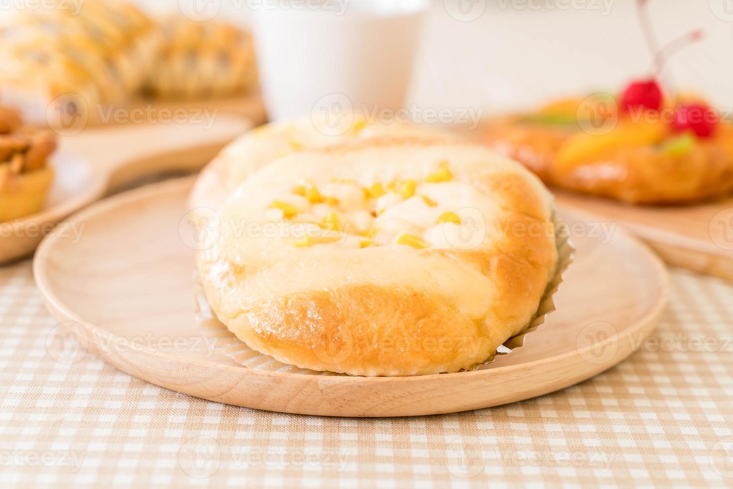 Bread with corn and mayonnaise on the table photo