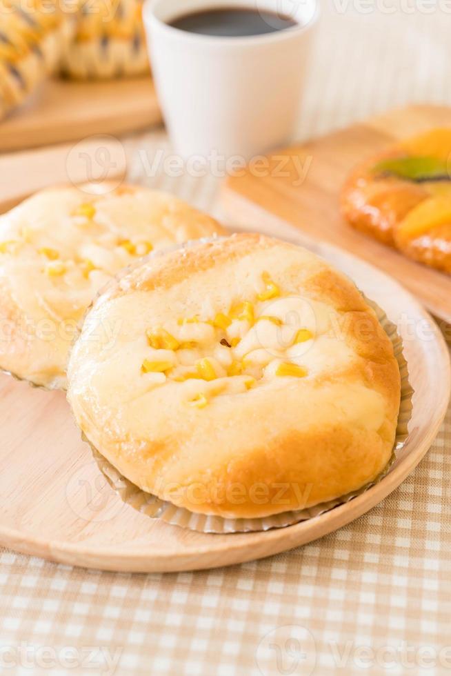 Bread with corn and mayonnaise on the table photo