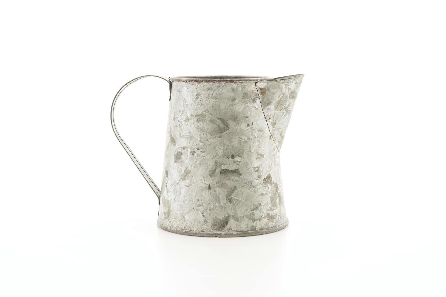 Iron jug on white background photo