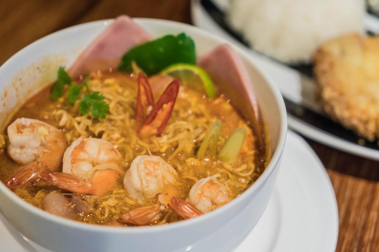 Spicy noodle Tom Yum with shrimp photo