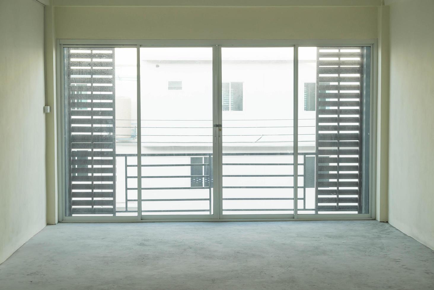 Empty glass door in living room interior background photo