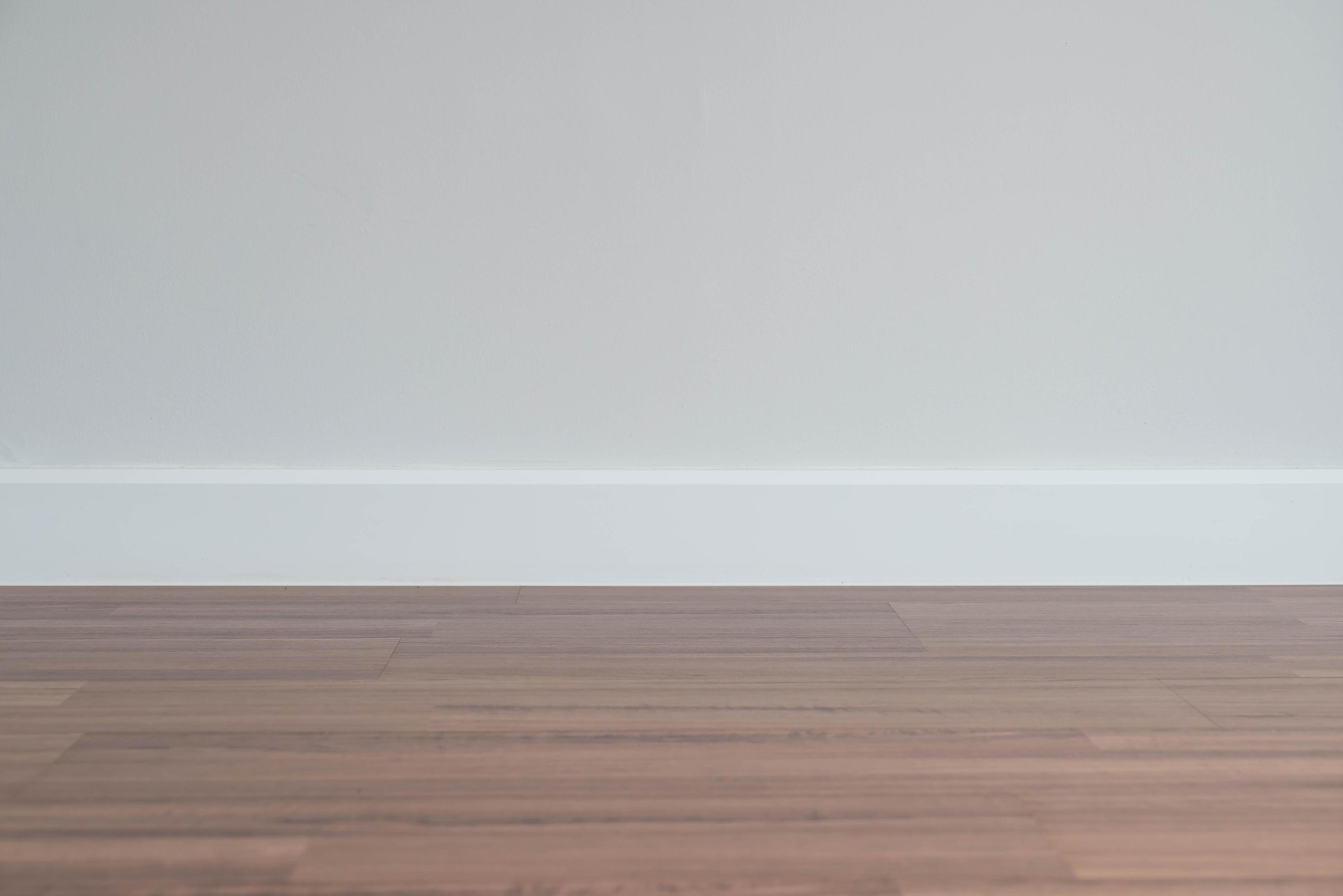 Copyspace background with an empty wall with a wooden floor below