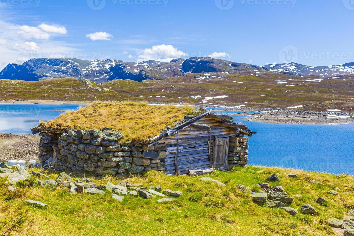 Vavatn lake panorama landscape huts snowy mountains Hemsedal Norway. photo