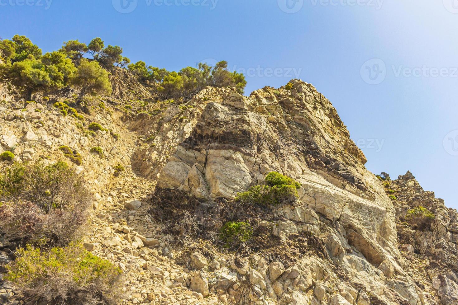 Natural rough landscapes on Kos Island Greece mountains cliffs rocks. photo