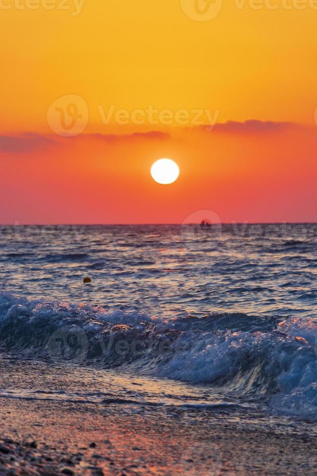 The most beautiful colorful sunset at Ialysos Beach Rhodes Greece. photo