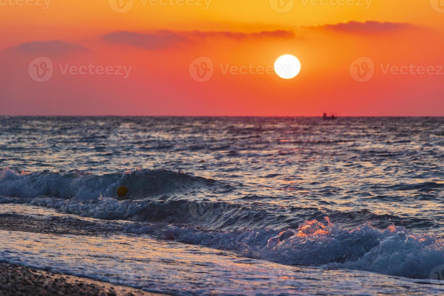 The most beautiful colorful sunset at Ialysos Beach Rhodes Greece. photo