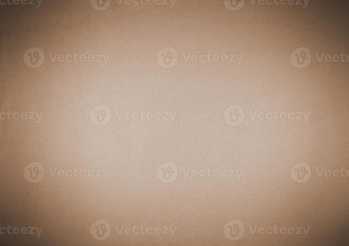 Old brown paper background with dark vignette. photo