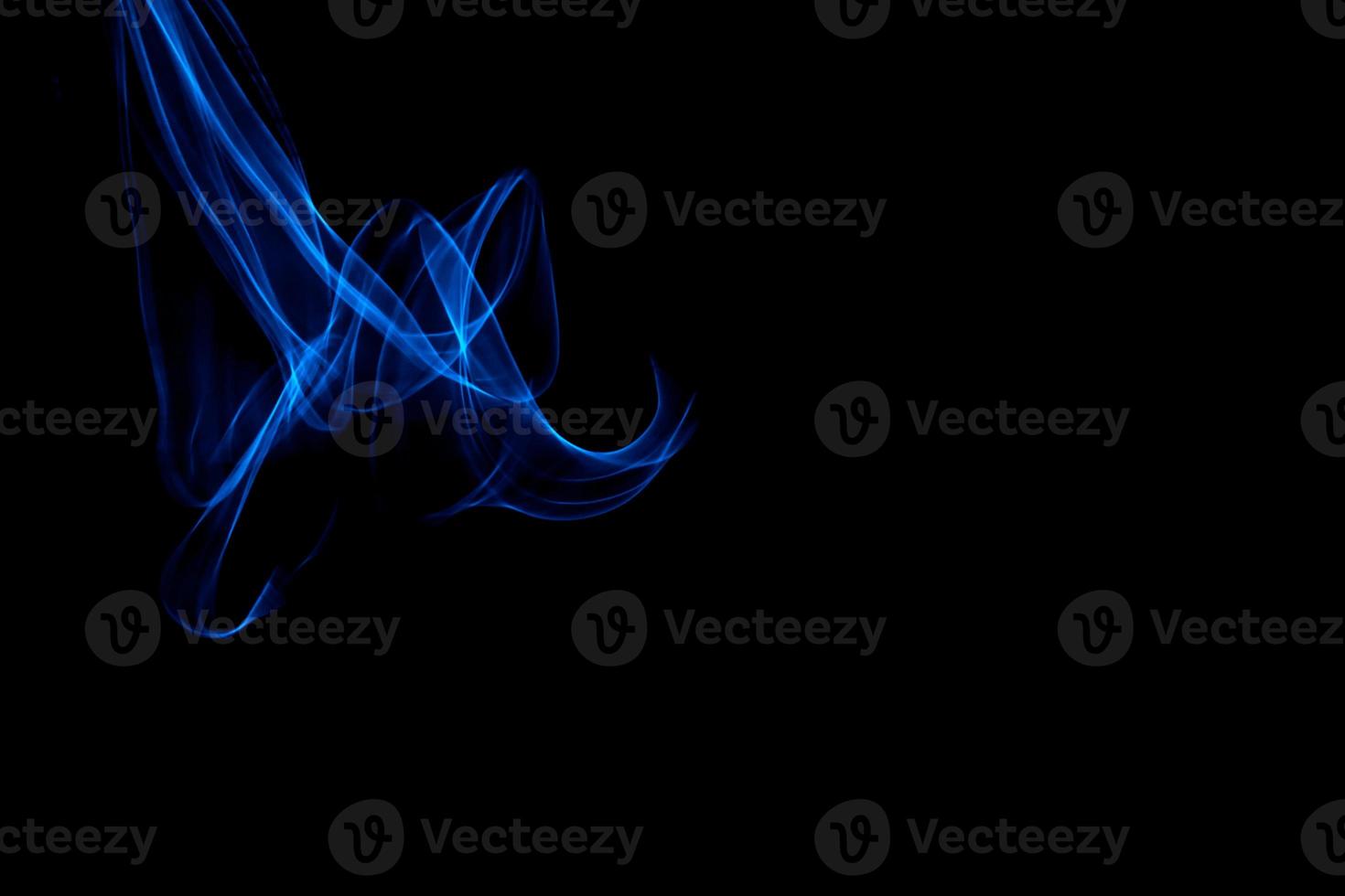 Glowing abstract curved blue lines photo